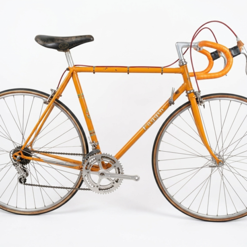 Vintage orange Faggin Corsa bicycle from the late 1960s with verified Campagnolo Nuovo Record parts, Cinelli cockpit, and Universal brakes for sale on ciclileggenda.com.