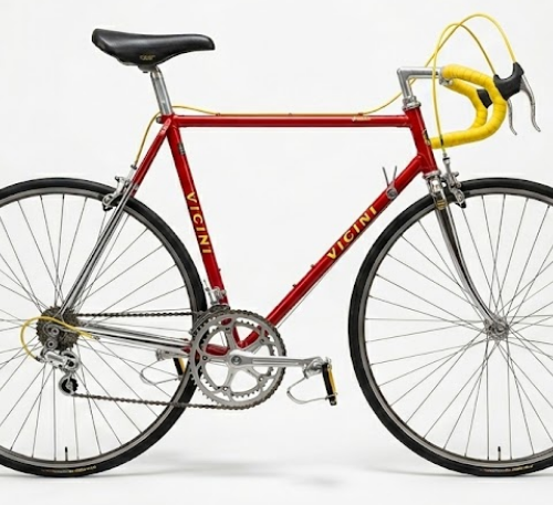 Vintage Vicini red racing bike with yellow bar tape and Campagnolo groupset