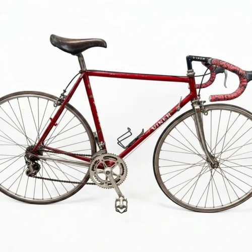 A complete side profile view of a preserved 1970s metallic bordeaux Viner Special Professional road bicycle with Campagnolo Nuovo Record groupset on a plain white background.